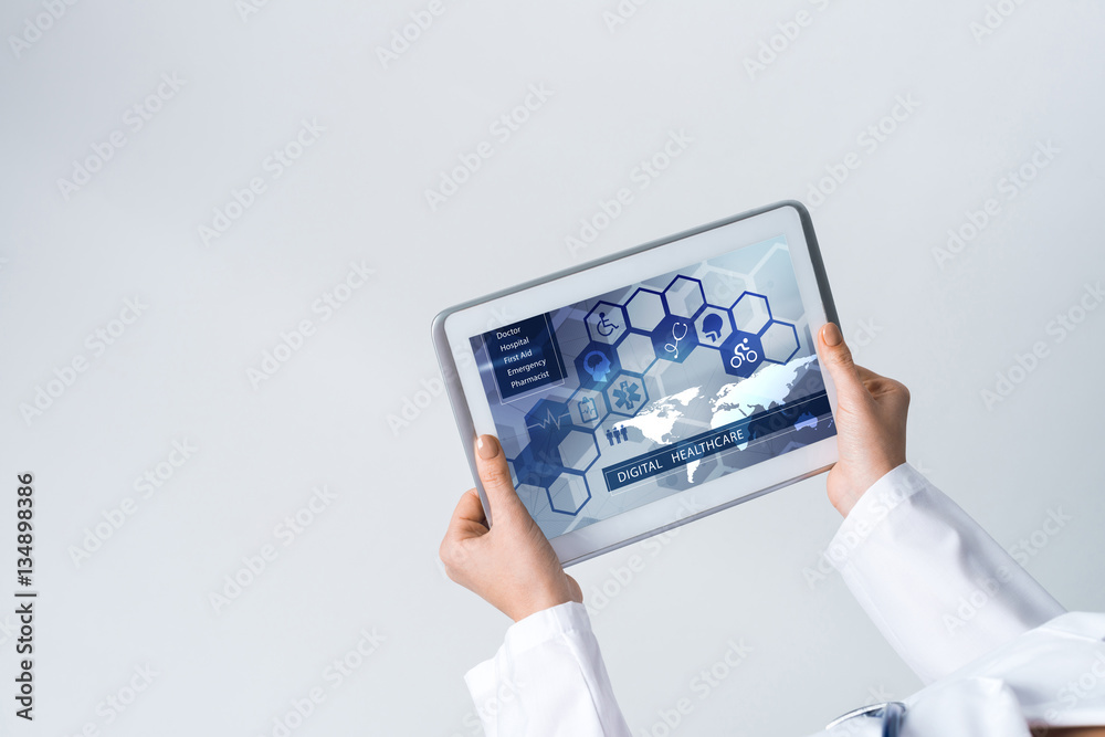 Close of female doctor hands working with tablet pc computer