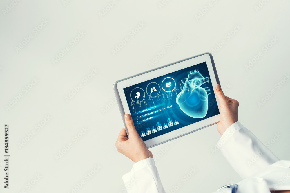 Close of female doctor hands working with tablet pc computer