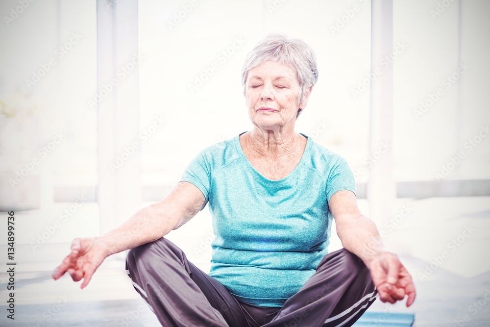 Woman performing yoga at home