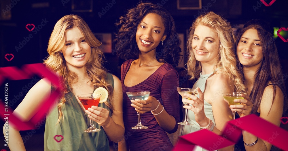 Composite image of portrait of friends having a drink