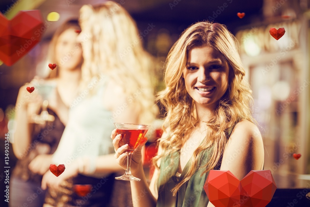 Composite image of portrait of blonde woman drinking cocktail