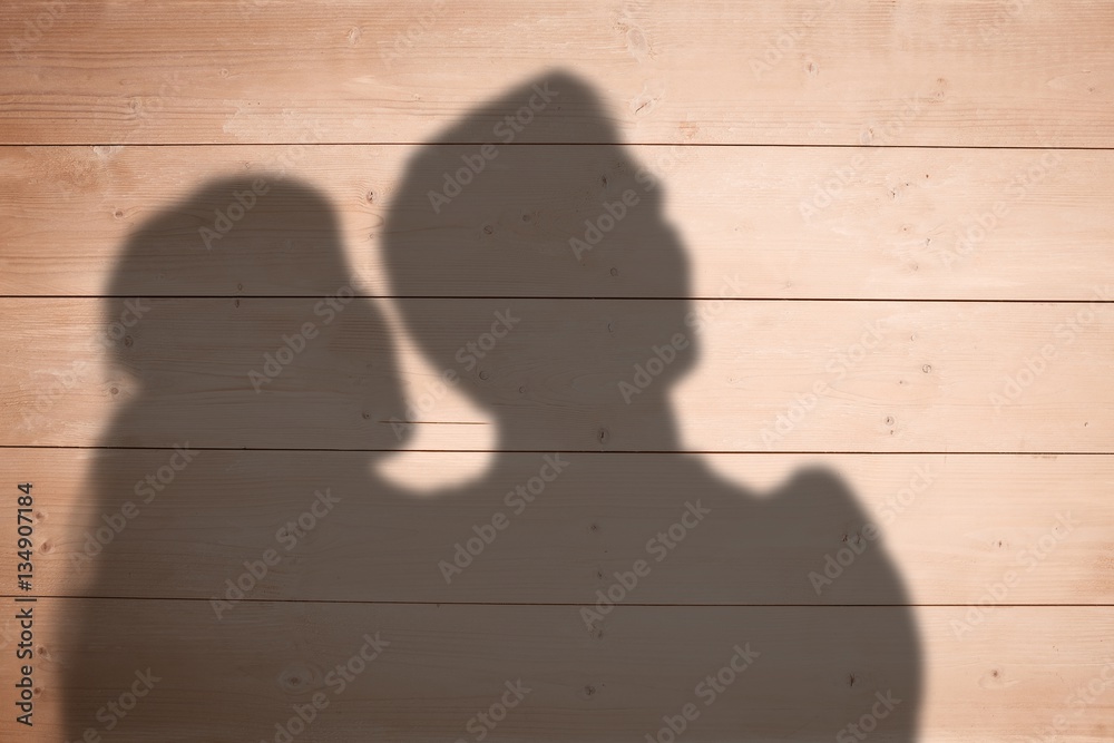 Composite image of happy couple looking upwards