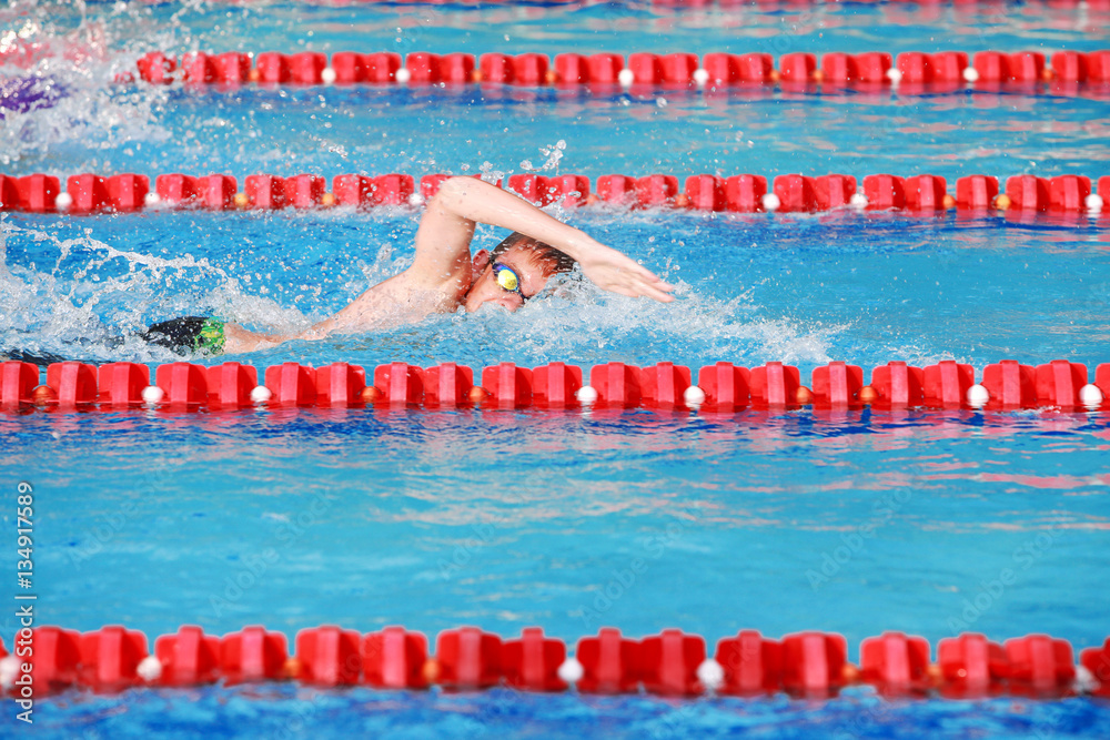 Motion blurred freestyle swimmer