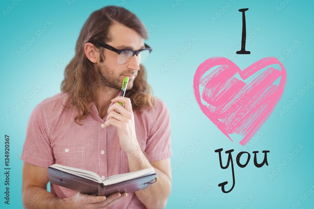 Composite image of thoughtful hipster holding pen and book