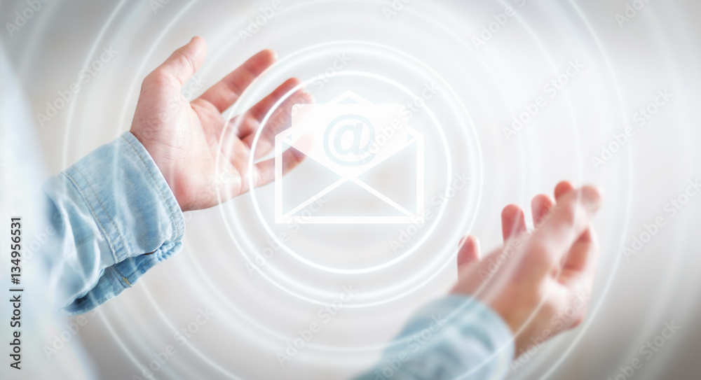 Businessman holding 3D rendering flying email icon in his hand