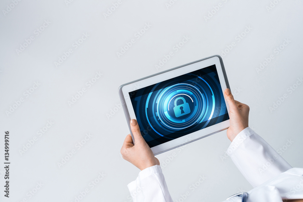 Close of female doctor hands working with tablet pc computer