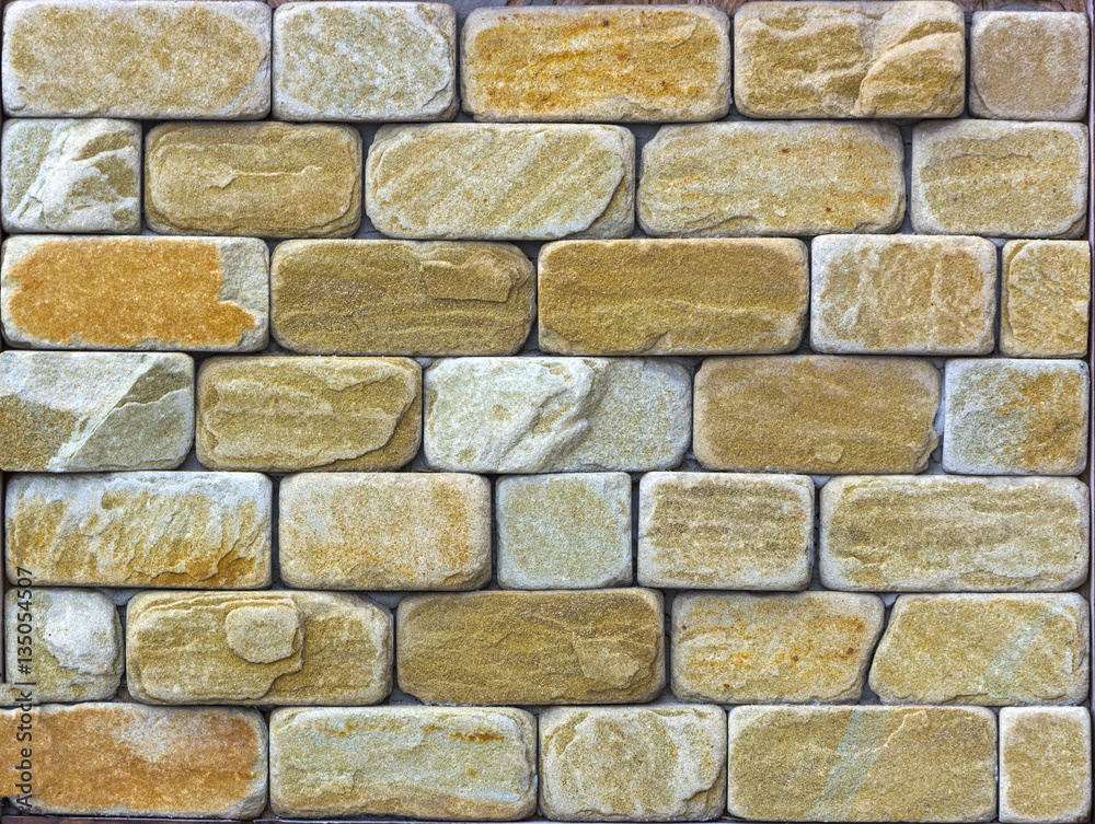 Wall of Indian sandstone with a beautiful structure, decorative building facing material