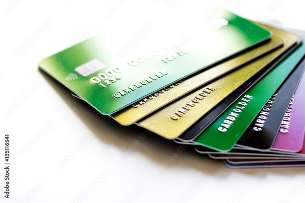 pile of credit cards on white background