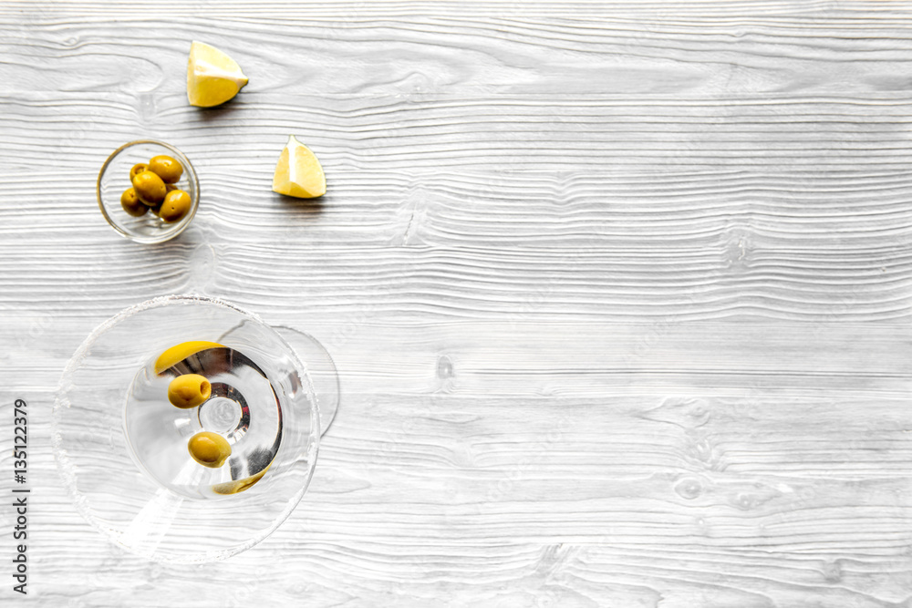 martini and shaker top view of wooden background