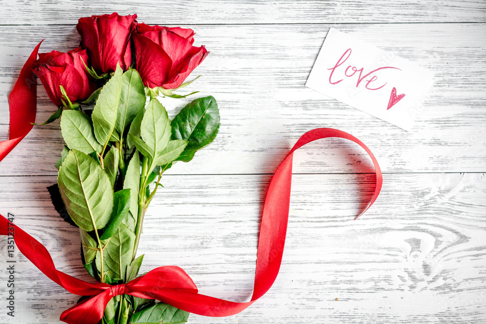 concept Valentines Day with flower wooden background top view