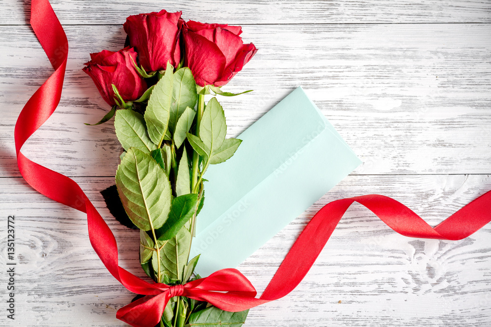 concept Valentines Day with flower wooden background top view