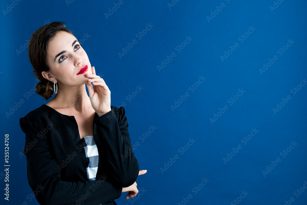 Young woman in a thoughtful pose