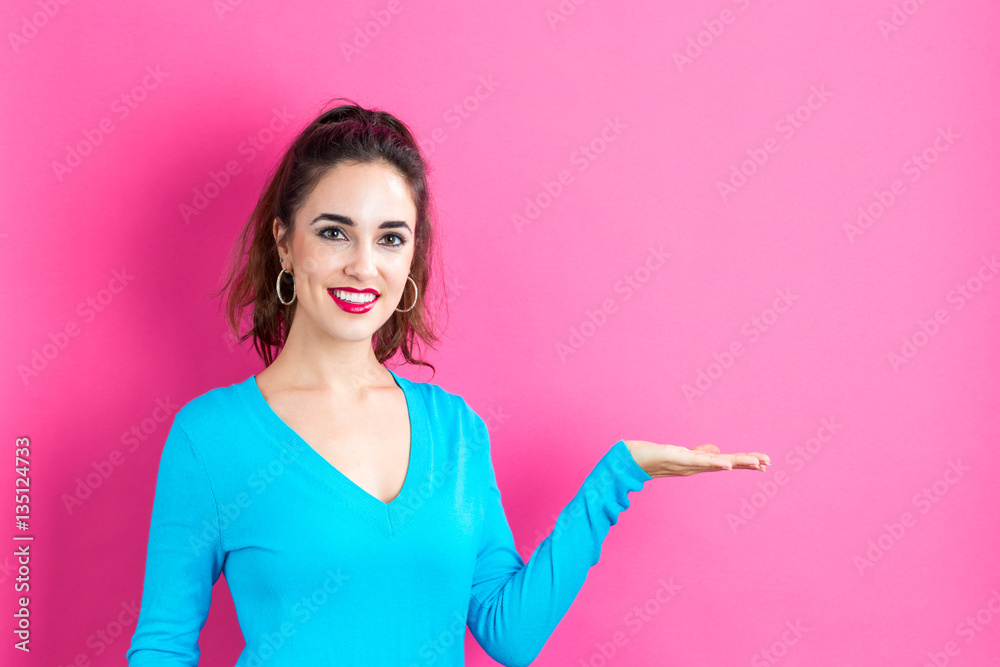 Young woman with a displaying hand gesture