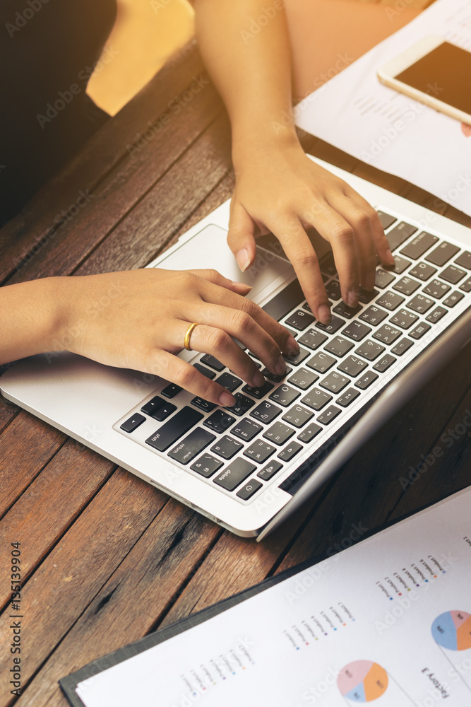 Womans Hand Typing on Laptop