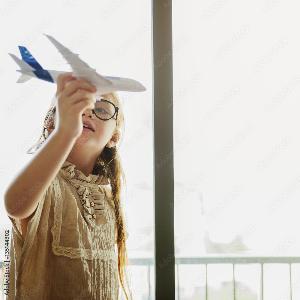 Girl Playing Plane Toy Concept