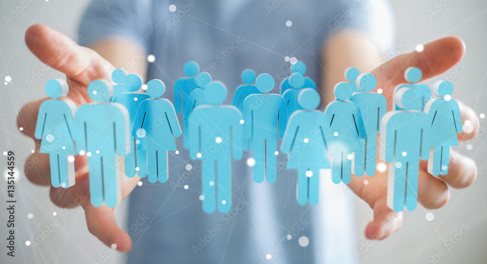 Businessman holding 3D rendering group of people in his hand