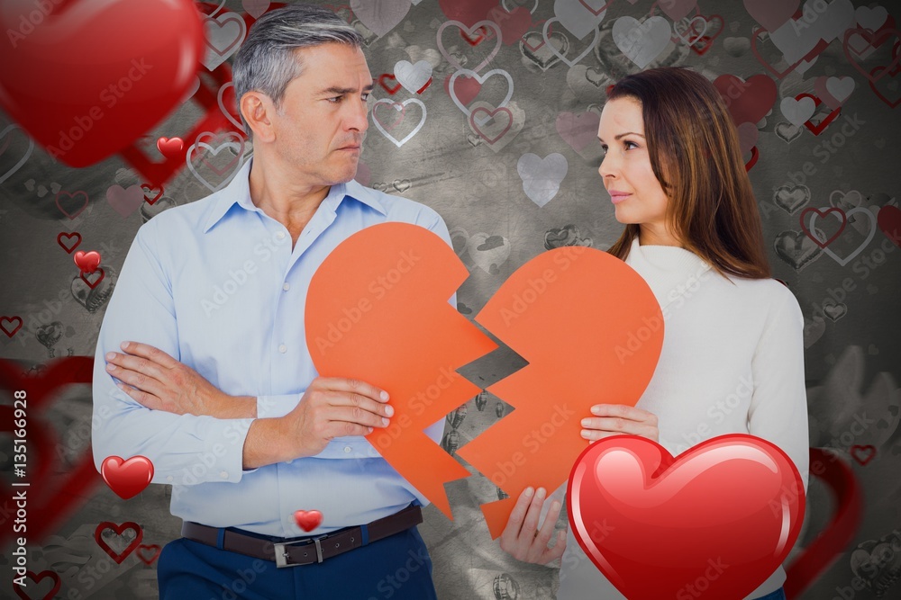 Composite image of couple holding broken heart shape paper 3D