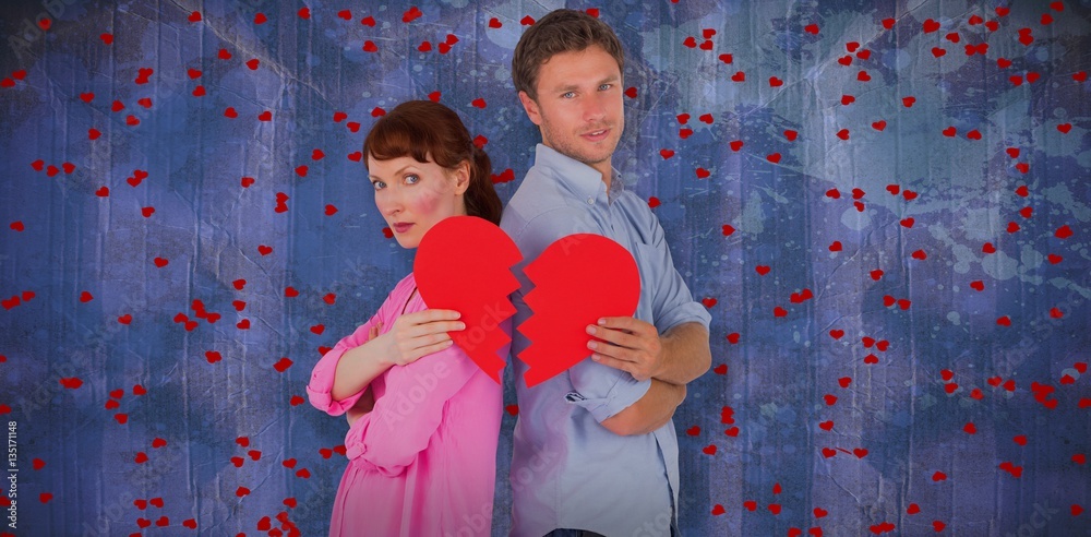 Composite image of couple holding a broken heart