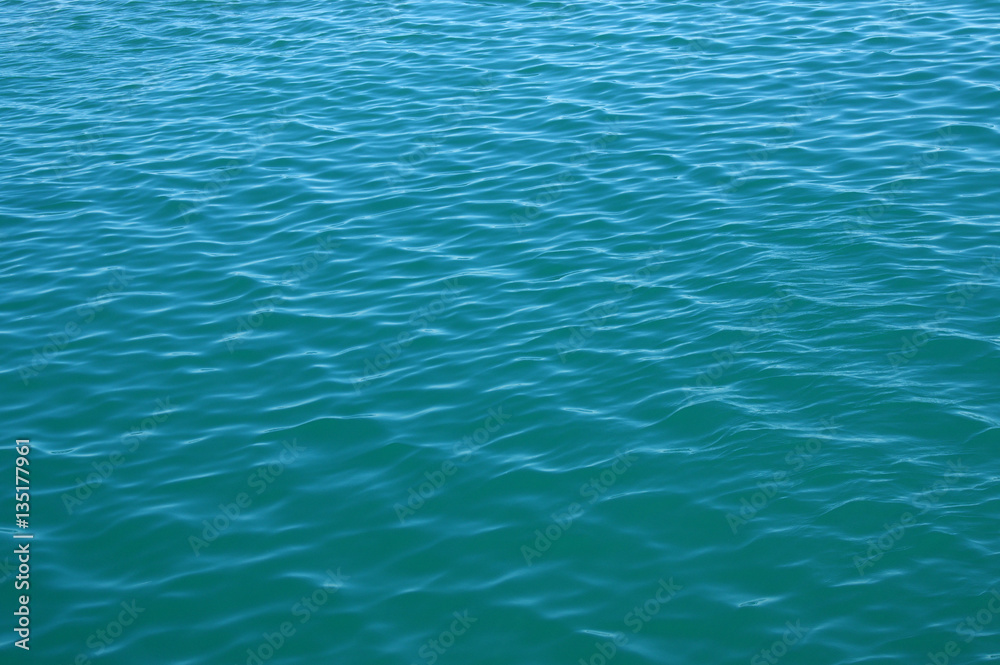 Blue sea surface with waves