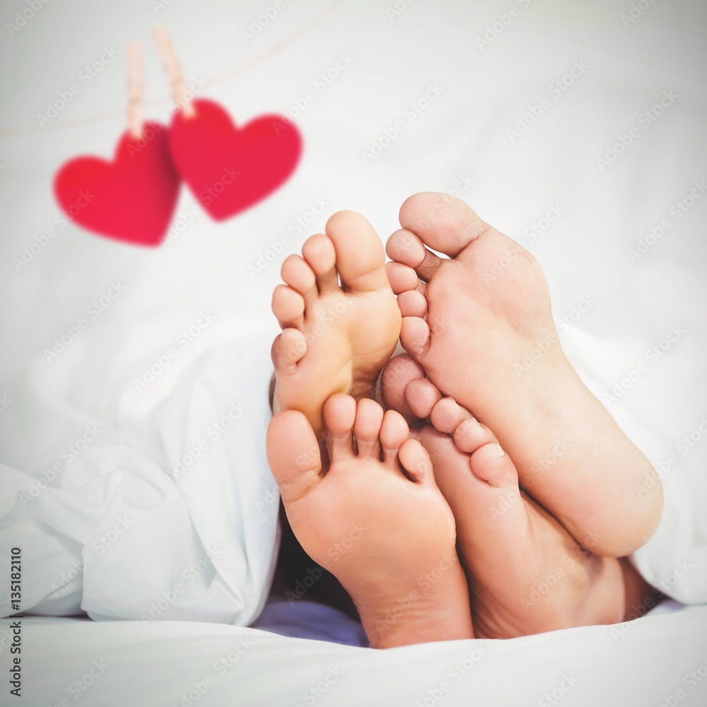 Composite image of hearts hanging on a line