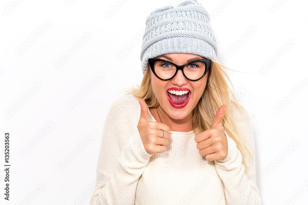 Happy young woman giving thumbs up