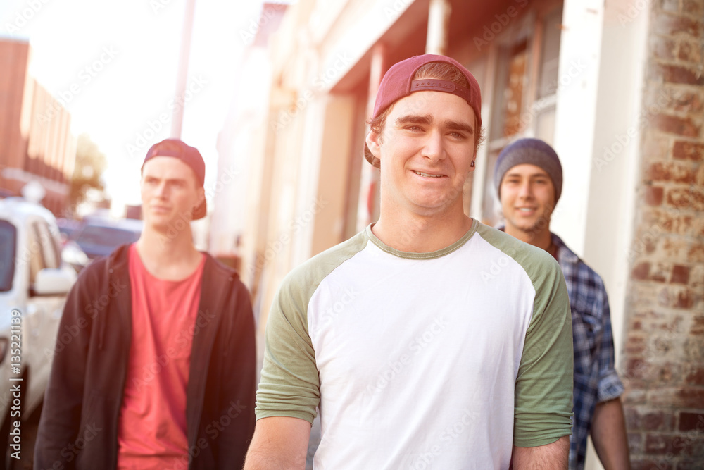 Guys skateboarders in street