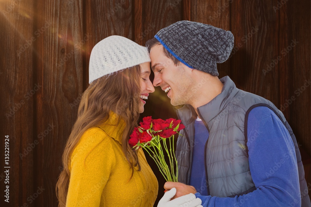 Composite image of happy couple holding flower bouquet