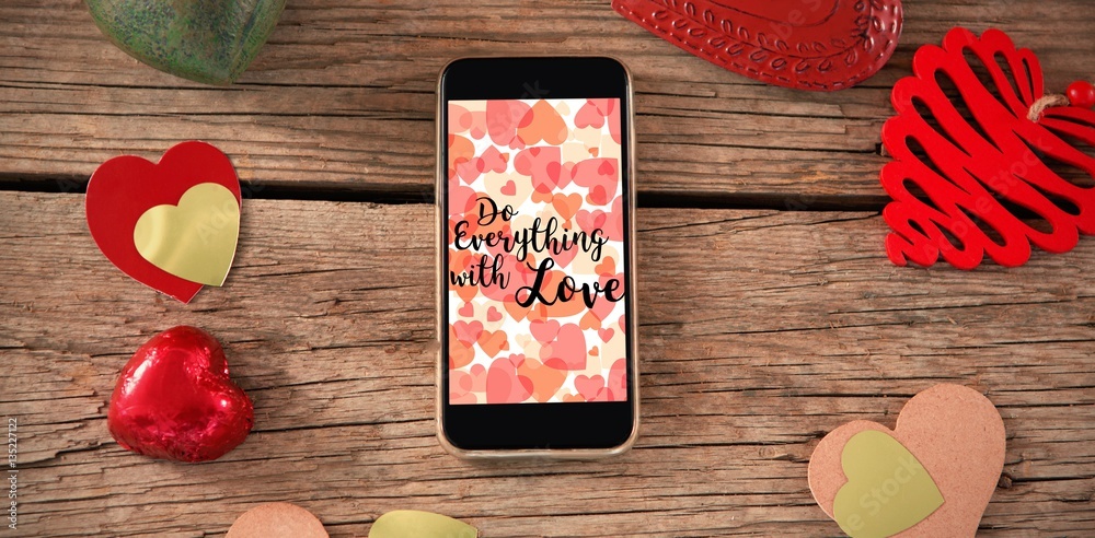 Web against smartphone and heart decorations