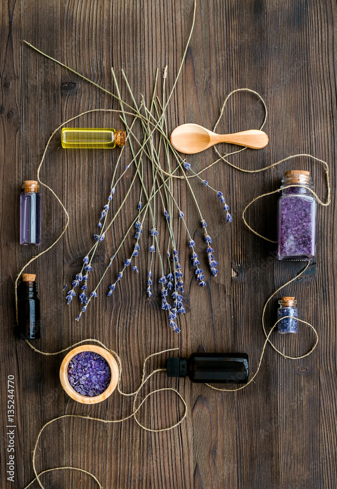 organic cosmetics with lavender on wooden background top view