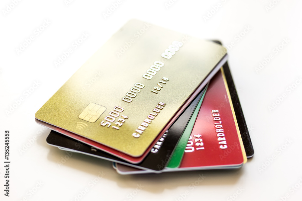 pile of credit cards on white background