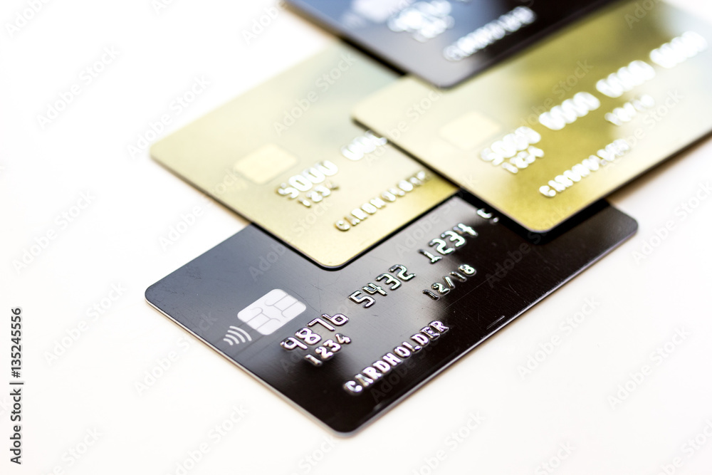 pile of credit cards on white background