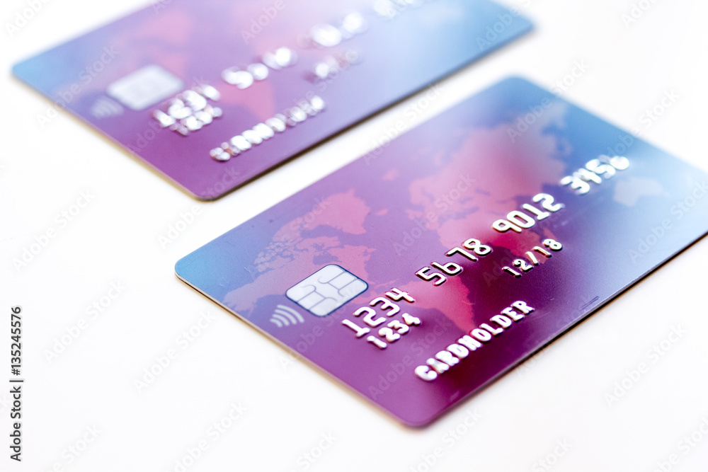 pile of credit cards on white background