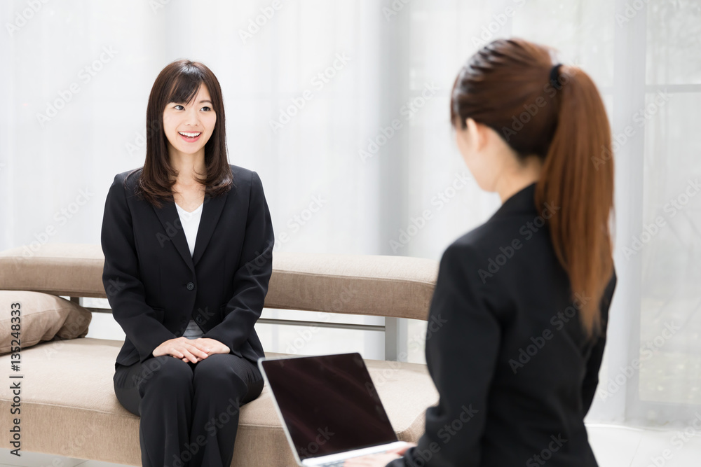 asian businesswomen talking in the room