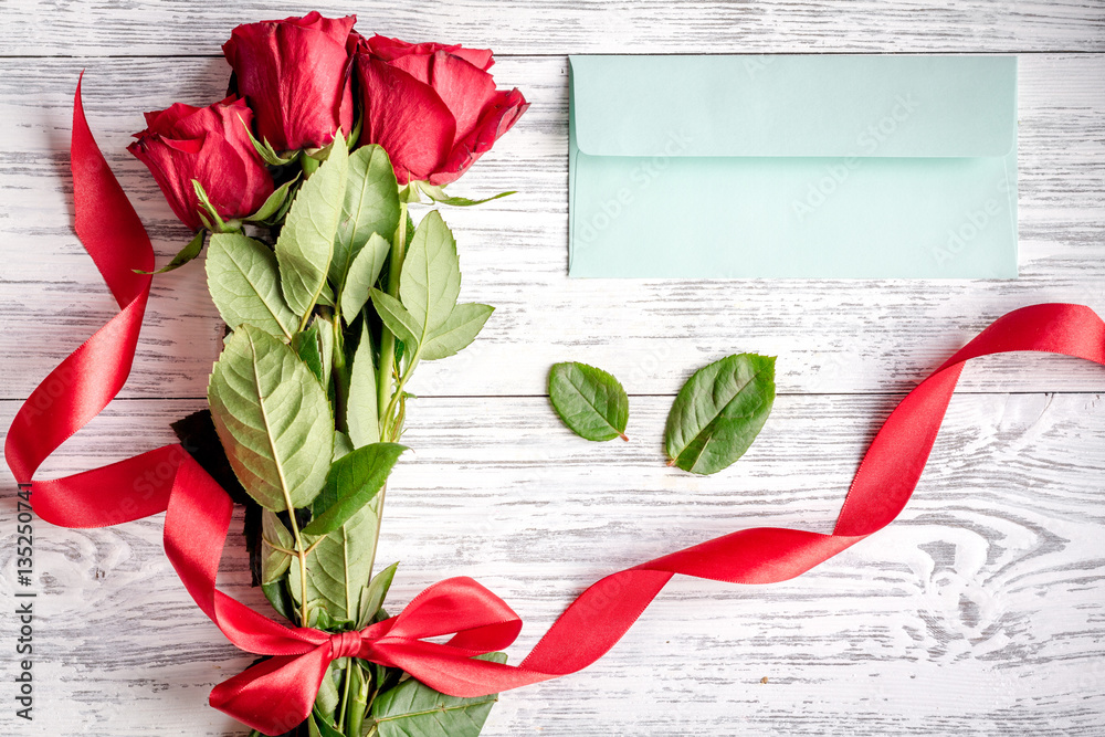 concept Valentines Day with flower wooden background top view