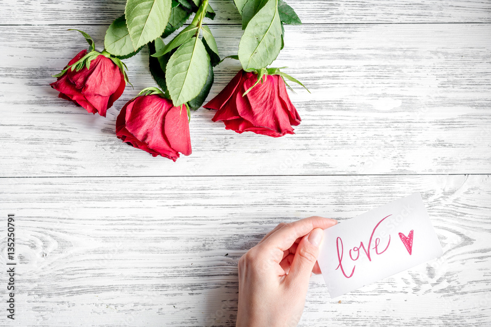 concept Valentines Day with flower wooden background top view