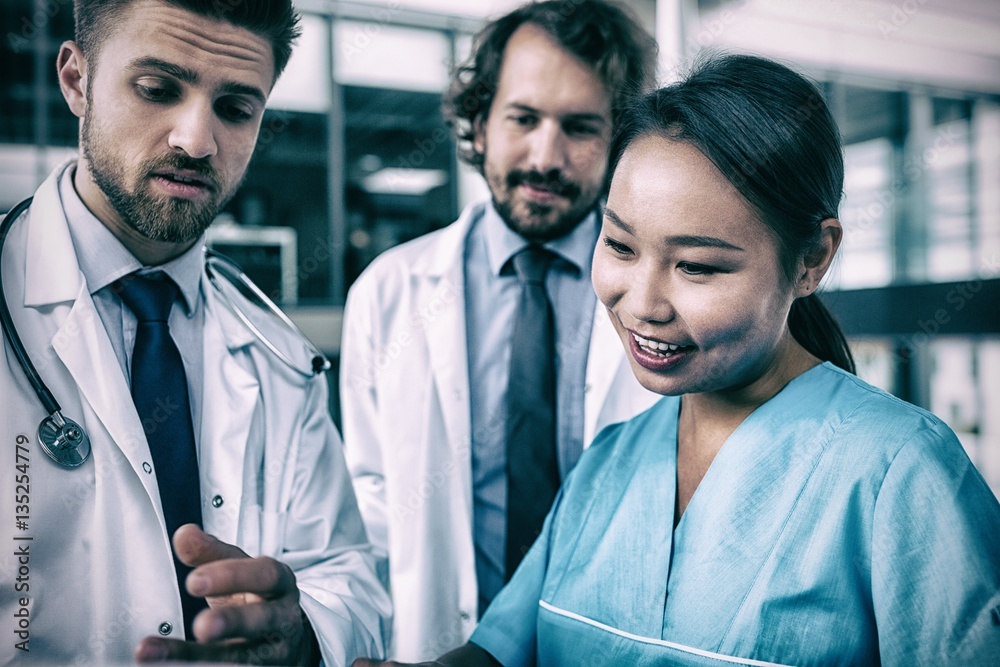 Doctors and nurse having discussion