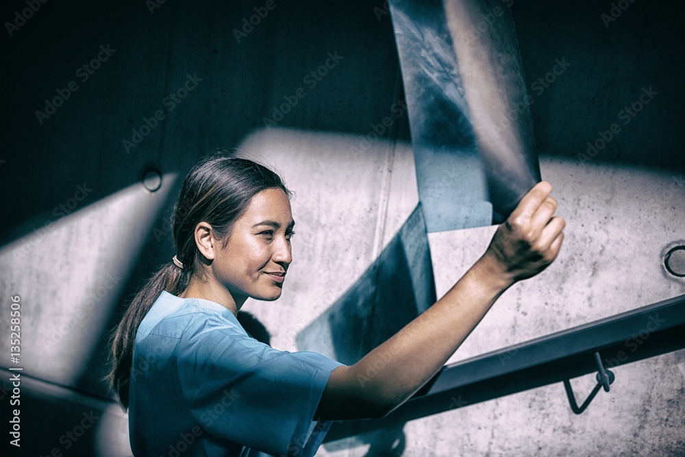 Smiling nurse examining X-ray report