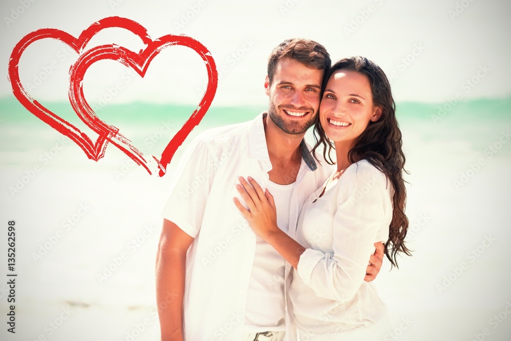 Composite image of happy couple looking at camera 