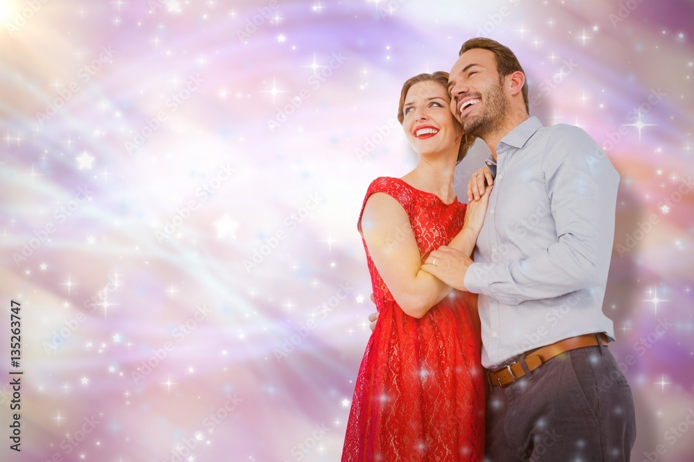 Composite image of young couple embracing each other