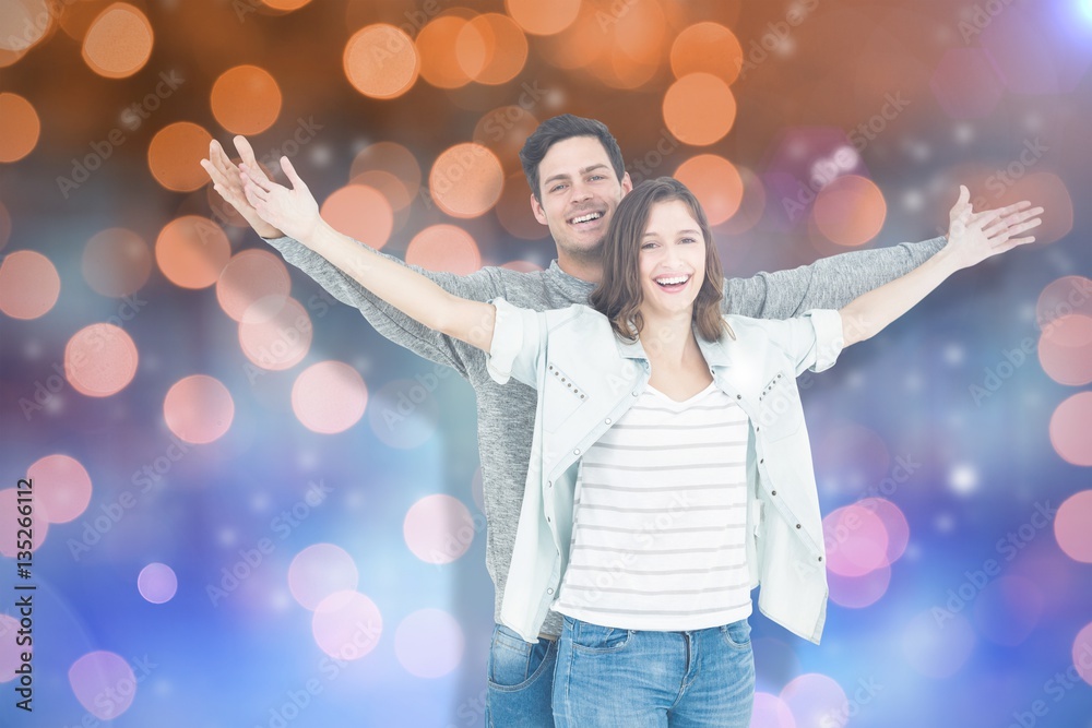 Composite image of couple embracing with arms outstretched