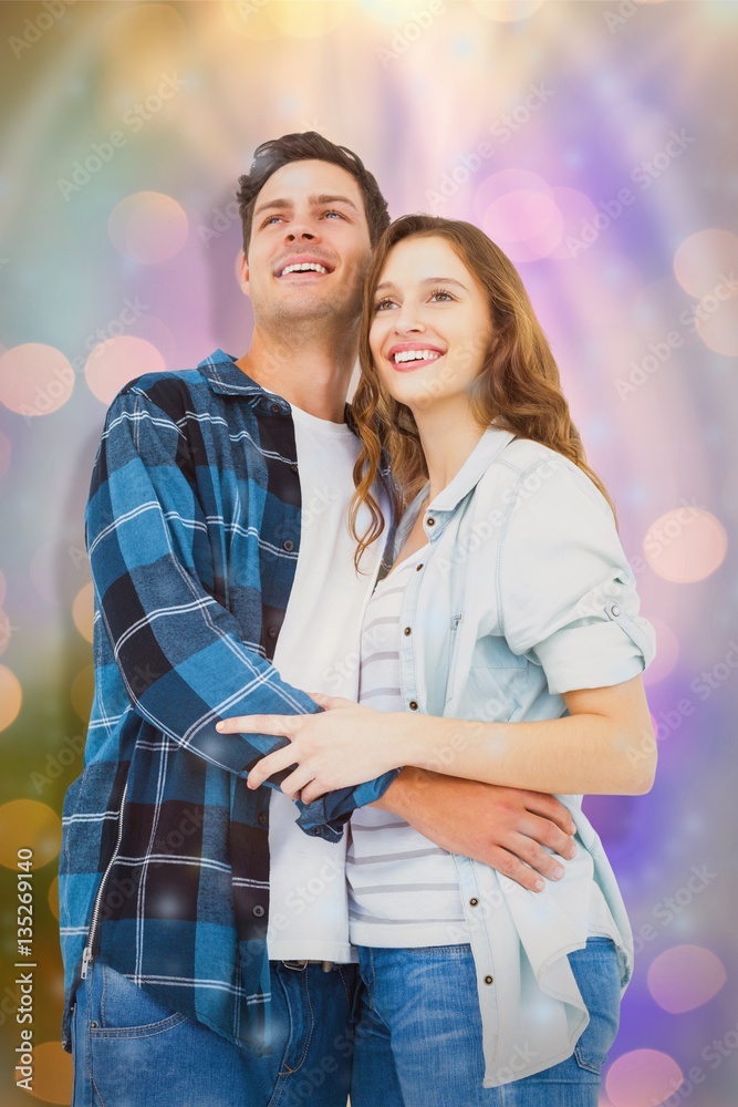 Composite image of couple standing and looking away