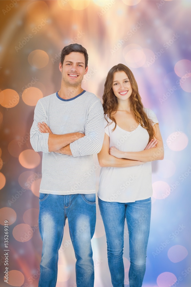 Composite image of portrait of happy couple with arm crossed