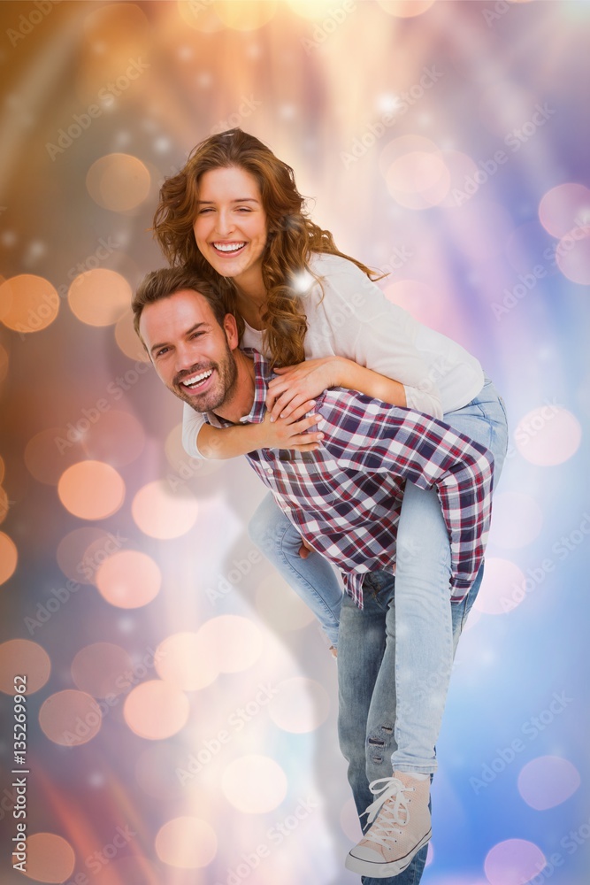 Composite image of man giving piggyback ride to woman