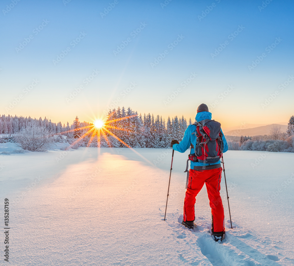 Snowshoe walker running in powder snow