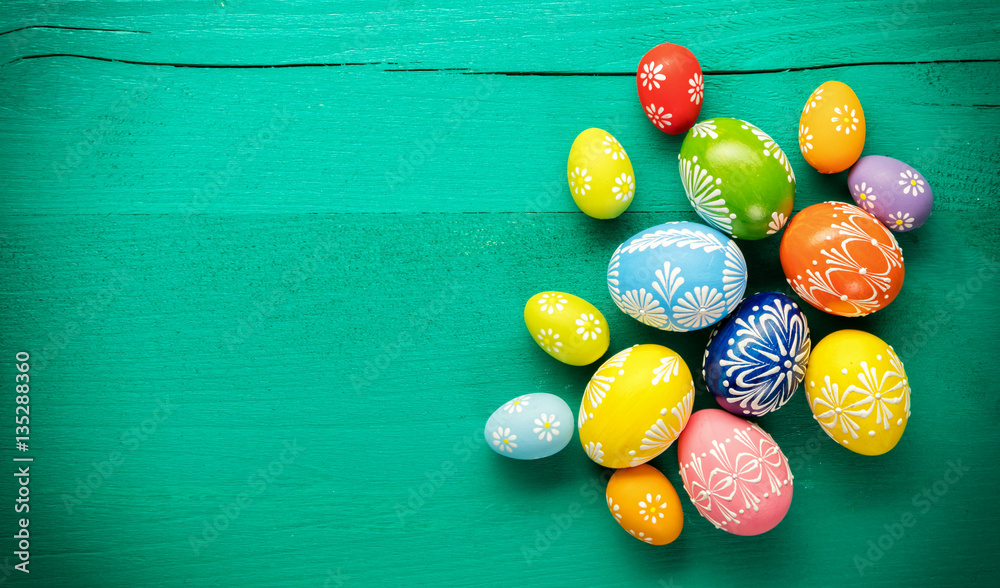 Easter eggs placed on wooden board