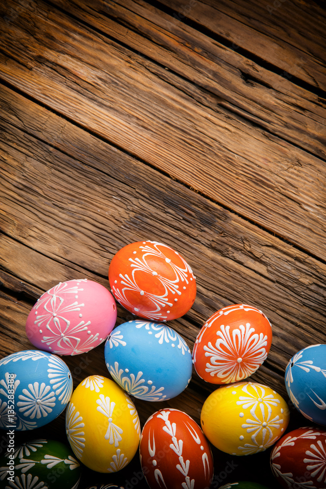 Easter eggs placed on wooden board