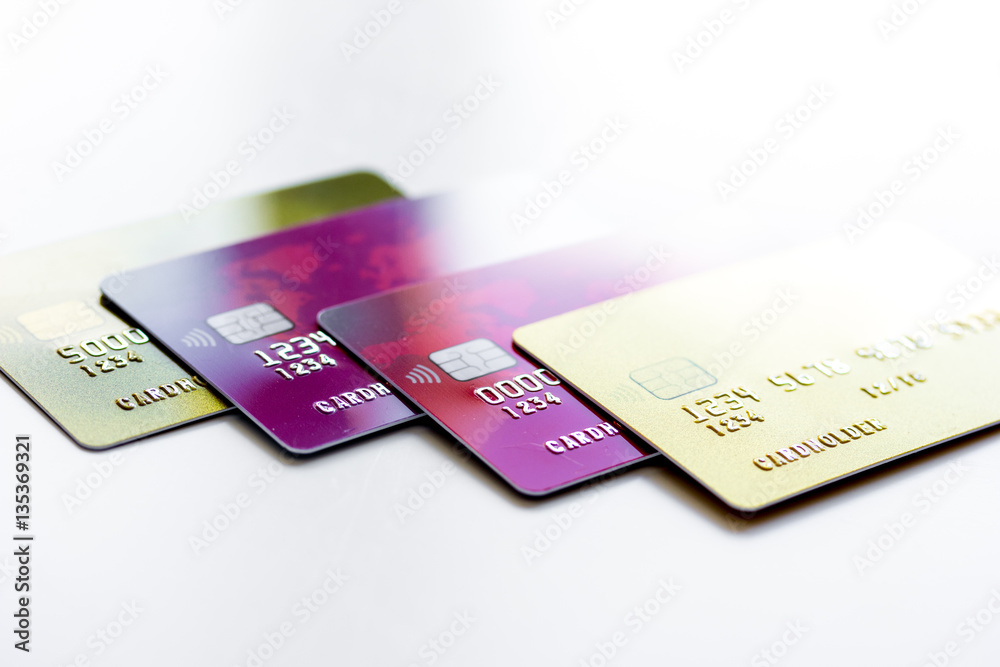 pile of credit cards on white background