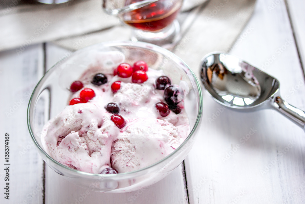 organic homemade ice cream in glass bowl on wooden background