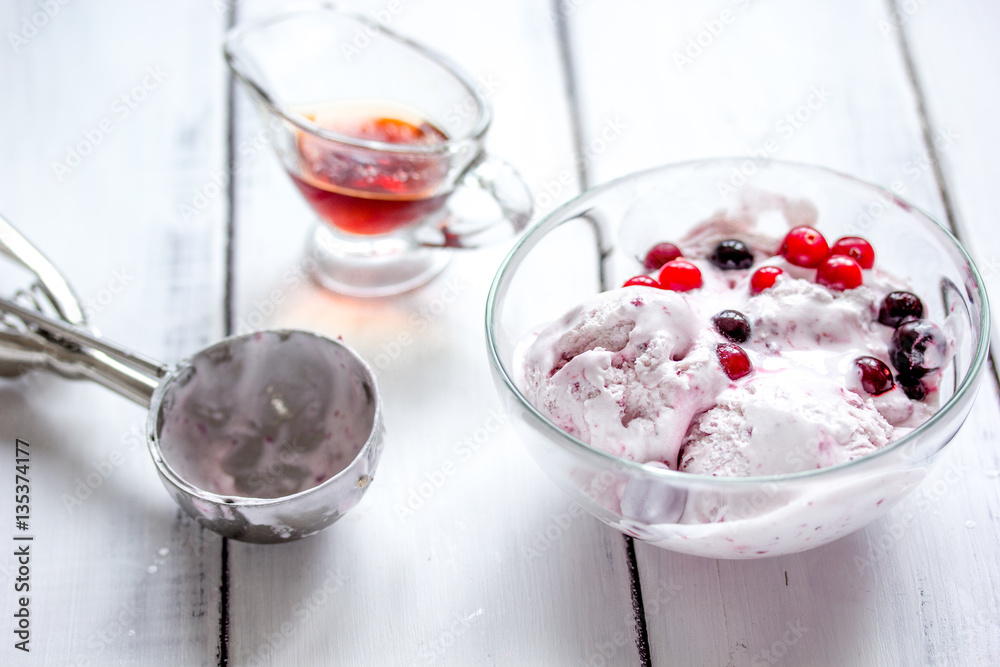 organic homemade ice cream in glass bowl on wooden background