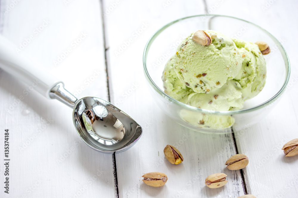 organic homemade ice cream in glass bowl on wooden background